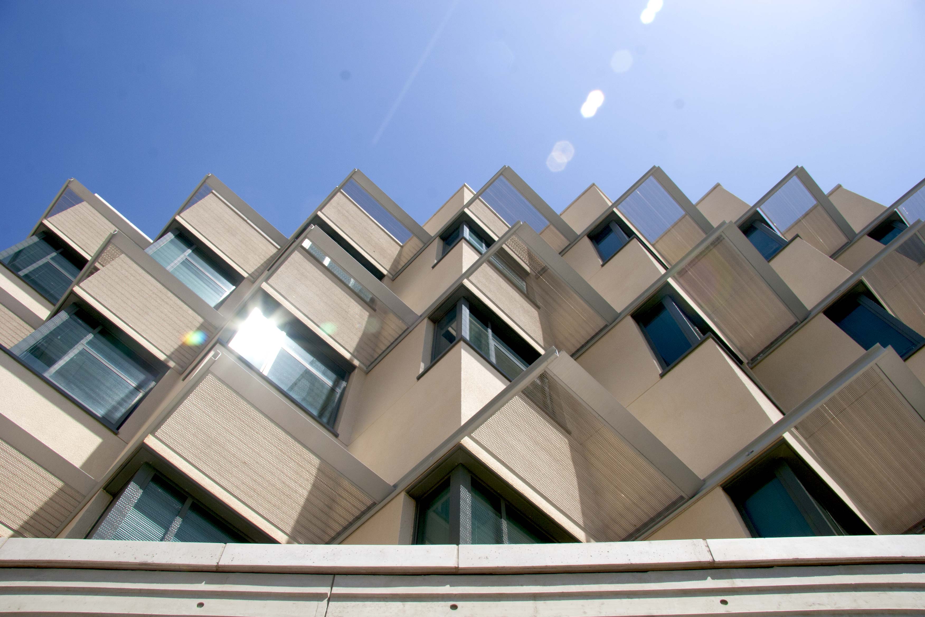 Marine Science building windows, view from the bottom looking at the blue sky