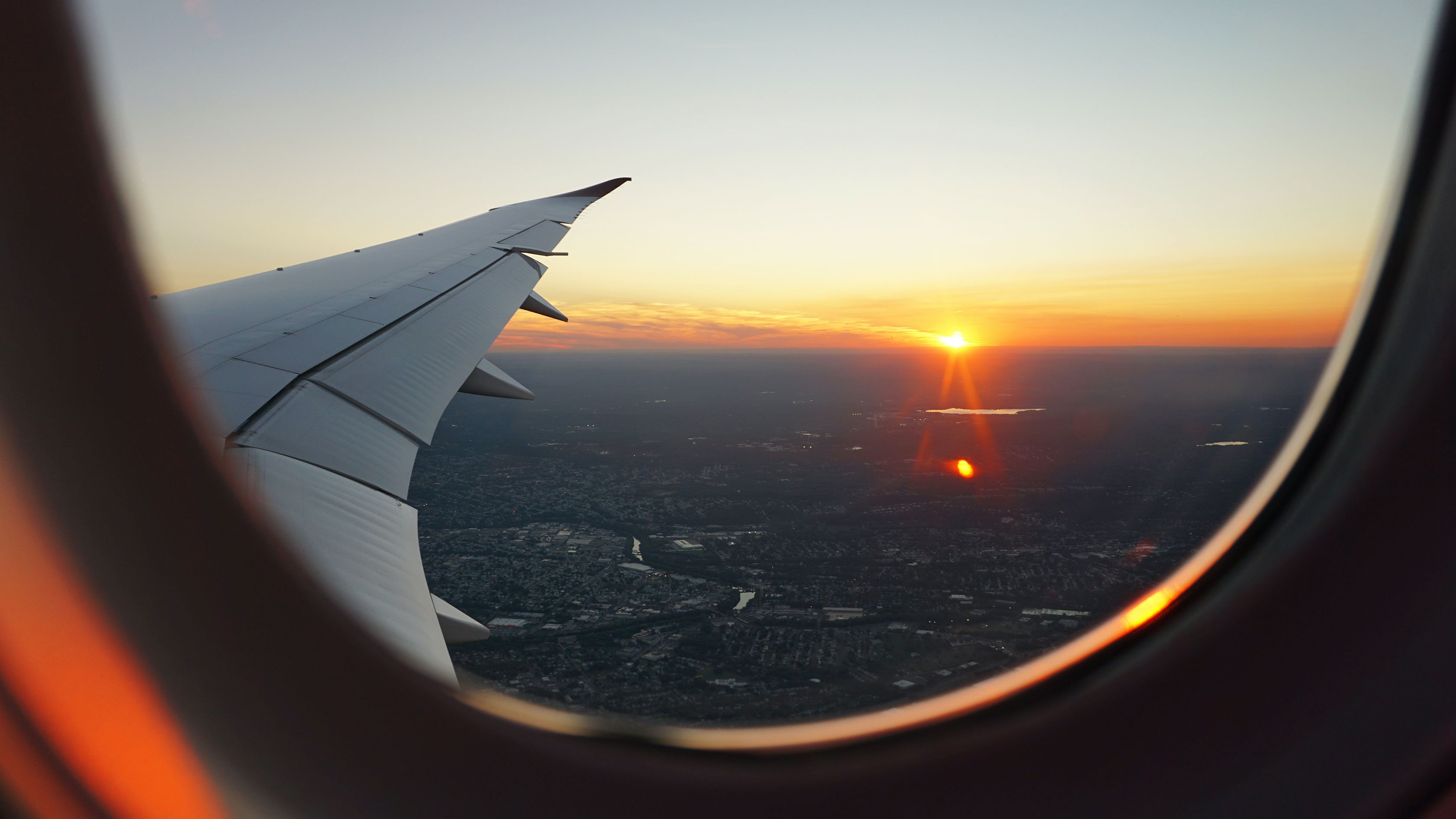 View of sunrise from airplane window