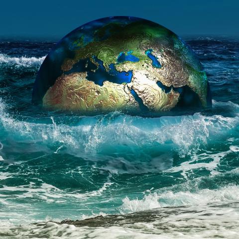 Illustration of the earth half immersed in wavy sea waters