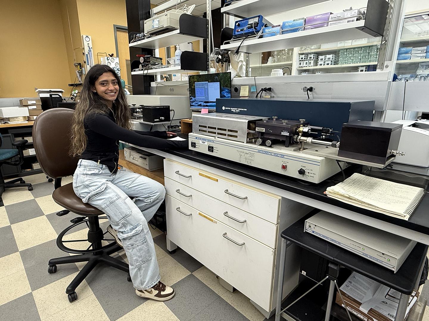 Ranjana analyzing data in front of computer in the AnaLab