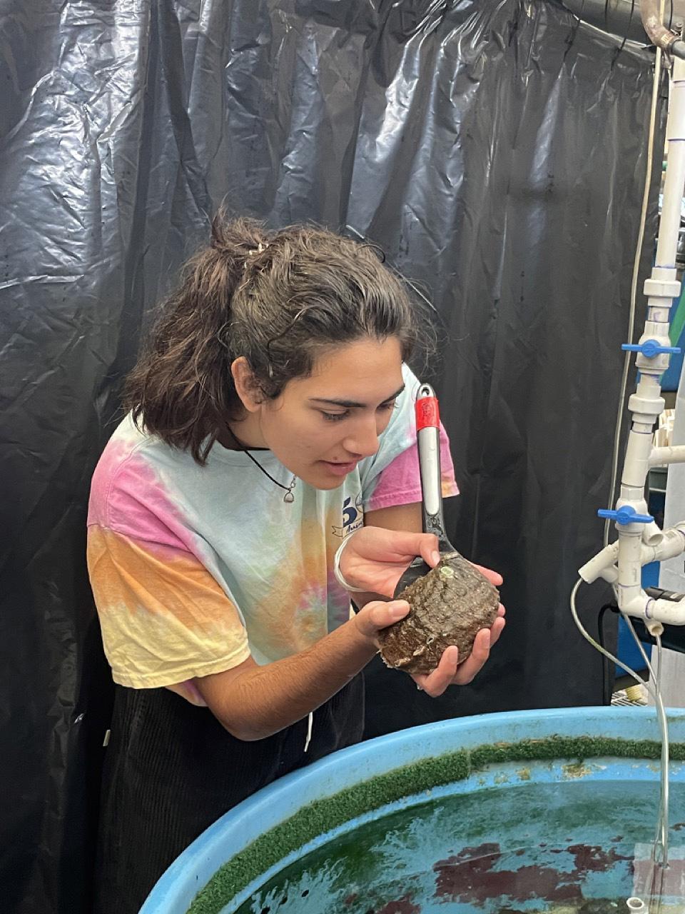 Gainna holding an abalone