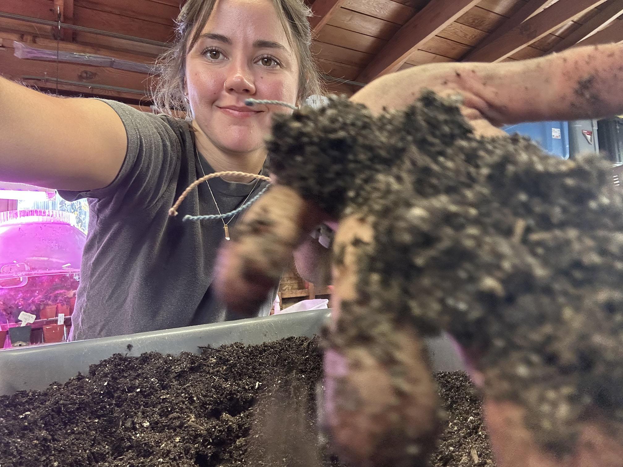 Kaitlin close up handling dirt