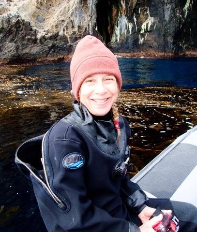 Jenn closeup wearing a beanie and smiling