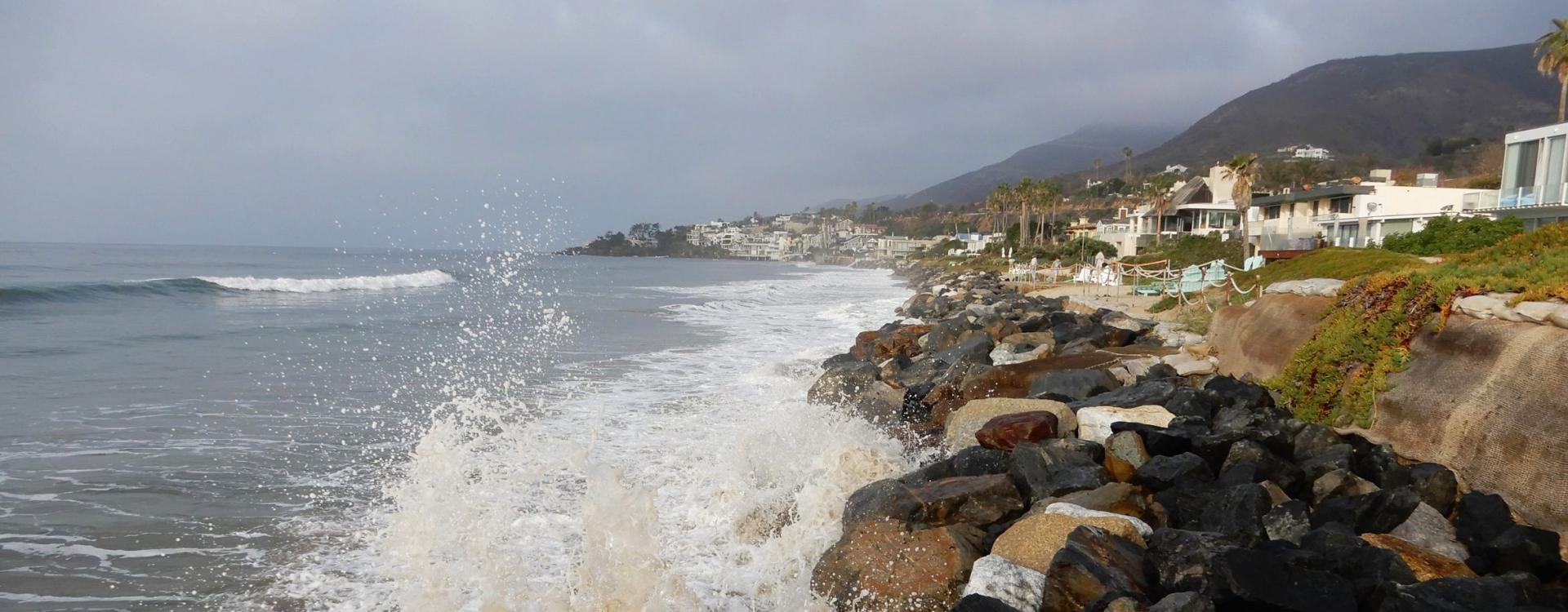 Coastal bluff and big waves crushing at Malibu beach