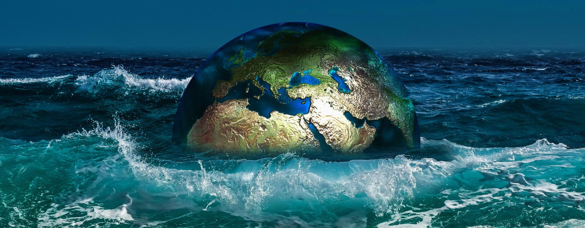 Illustration of the earth half immersed in wavy sea waters