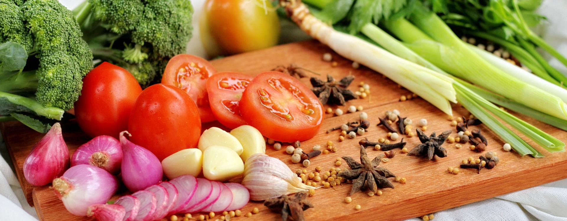 Cutting board with colorful vegetables and nuts