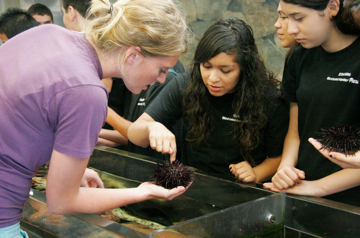 Undergraduate student gives a tour to SBHS students