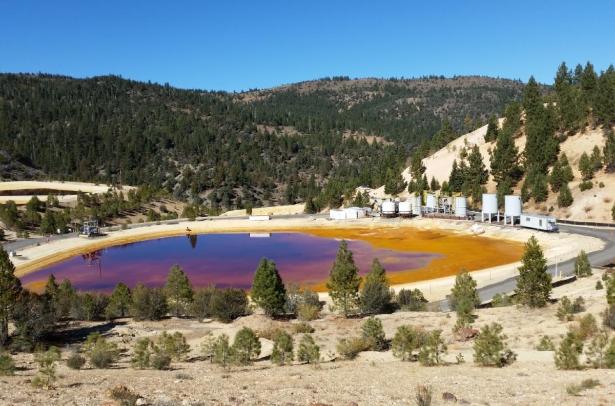 Containment pond collecting polluted runoff from mine