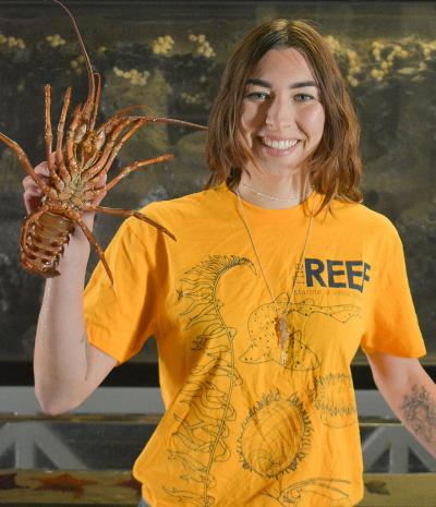 Lauren Jennings holds a big spiny lobster