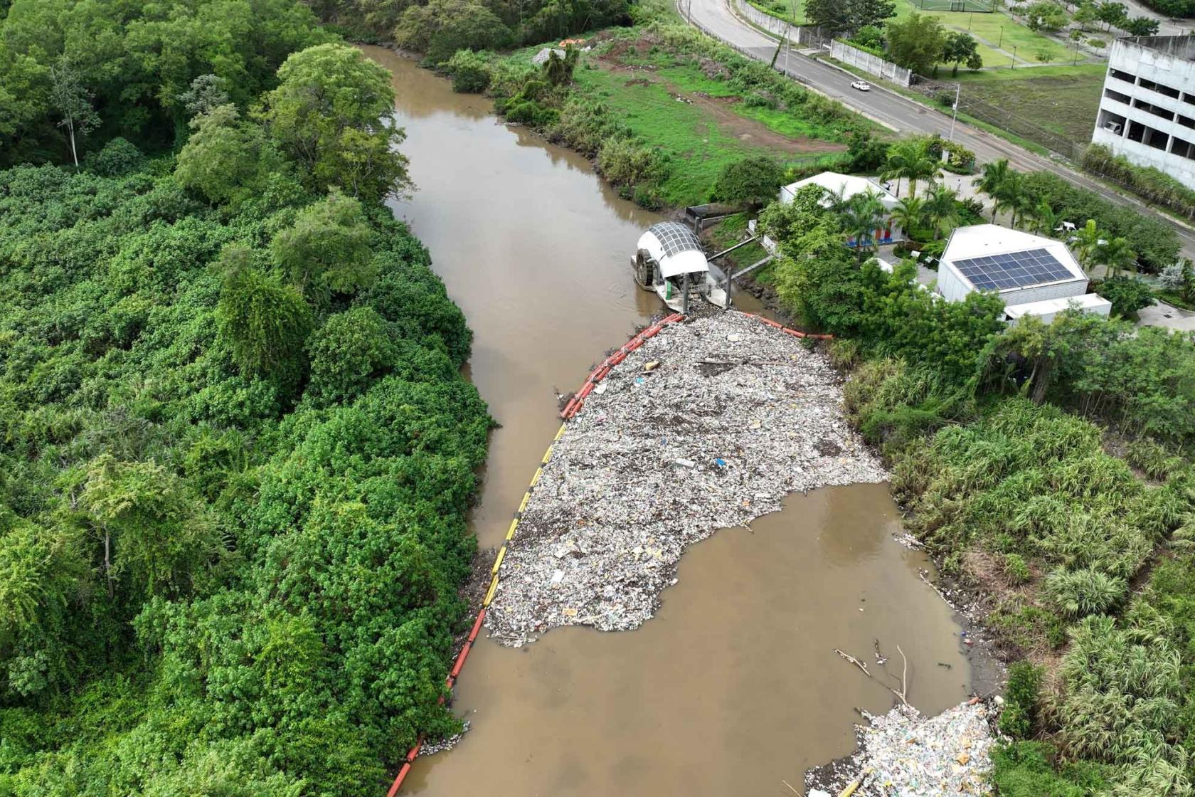 Aerial view of giant trash wheel in the Juan Díaz River